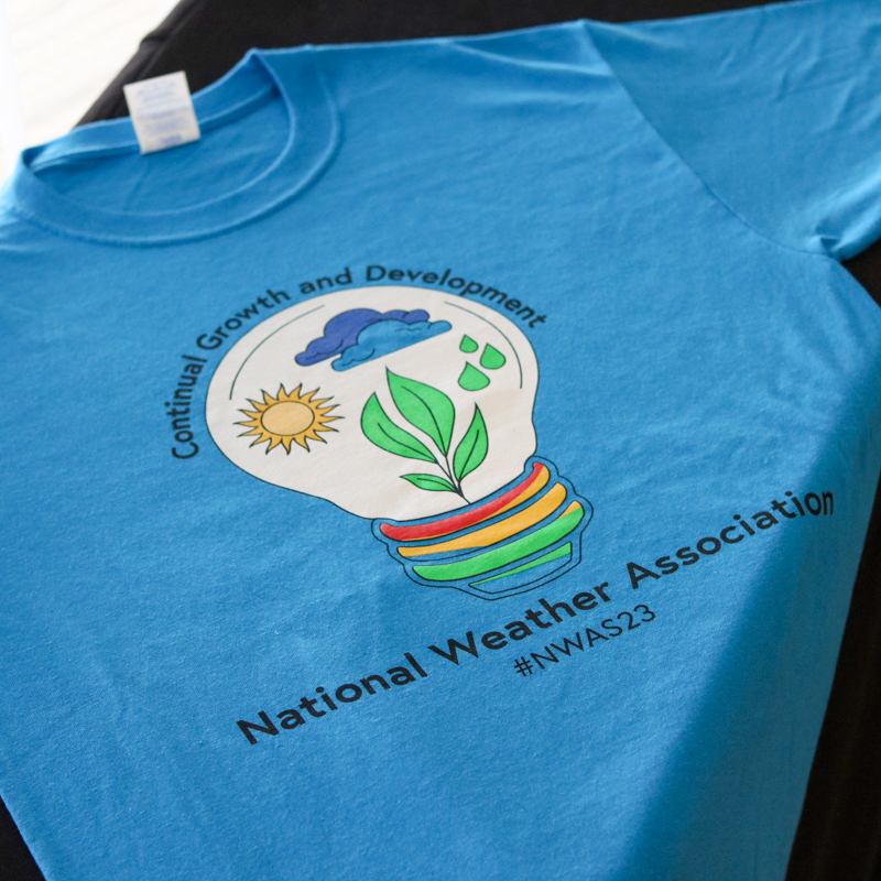 blue shirt with the 2023 NWA logo
