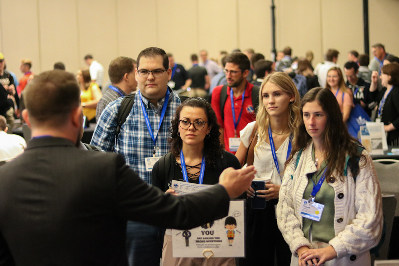 Attendees at the Annual Meeting listen to a showcase presentation